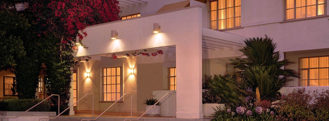 Exterior entrance of The Inn at UCLA at night.